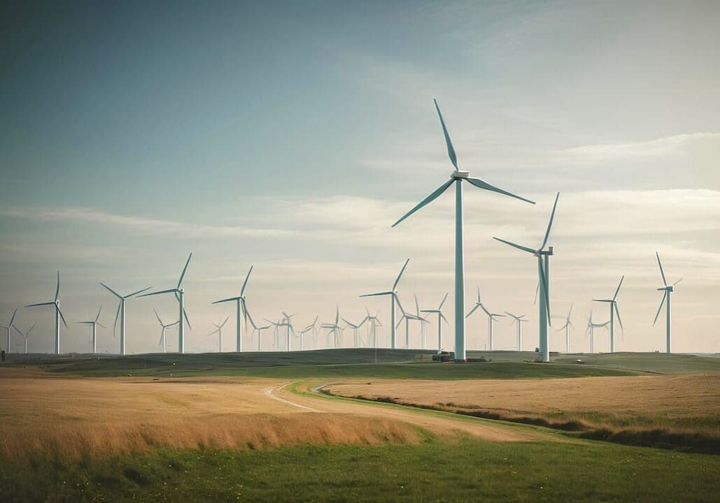 windmills-wind-turbines-farm-generating-electricity-green-meadow-green-energy-concept
